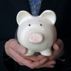 piggy bank in hands for HIgh Deductable Health Plans