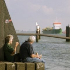 older couple sitting on pier for Whole Life Insurance